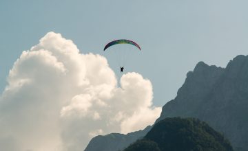 Paragliding Mangart clound and mountains
