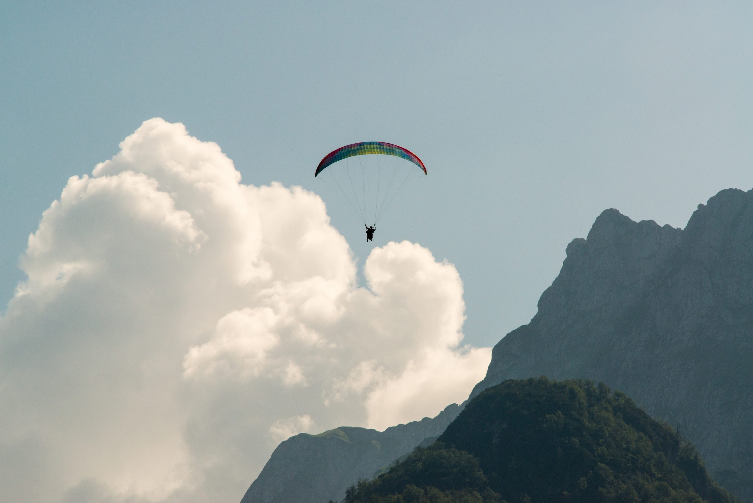 Paragliding Mangart clound and mountains